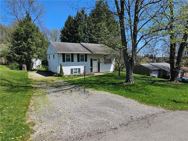 bi-level home with a front lawn and driveway