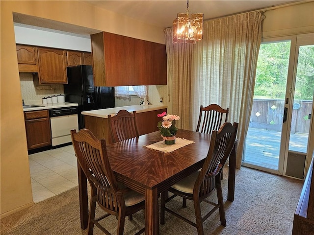 317 Chestnut Dr, Center Twp But, PA 16001 - dining room featuring light colored carpet, a chandelier, and light tile patterned floors