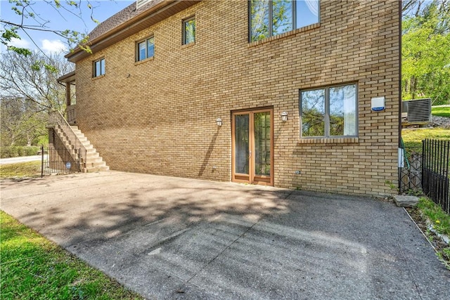 2408 Georgette St, Overbrook, PA 15234 - rear view of property with brick siding, fence, stairs, and a patio area