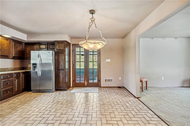 2408 Georgette St, Overbrook, PA 15234 - kitchen with dark brown cabinetry, french doors, stainless steel refrigerator with ice dispenser, visible vents, and pendant lighting