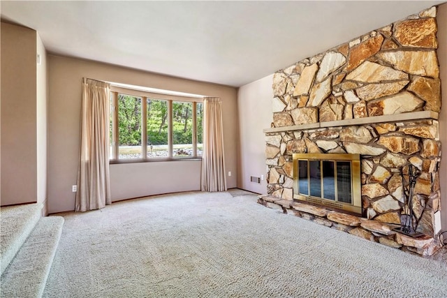 2408 Georgette St, Overbrook, PA 15234 - unfurnished living room with carpet floors, a stone fireplace, and visible vents