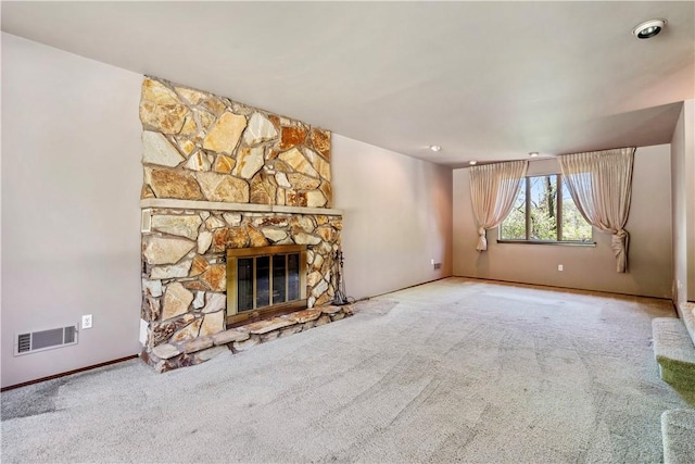 2408 Georgette St, Overbrook, PA 15234 - unfurnished living room featuring visible vents, carpet, baseboards, and a stone fireplace
