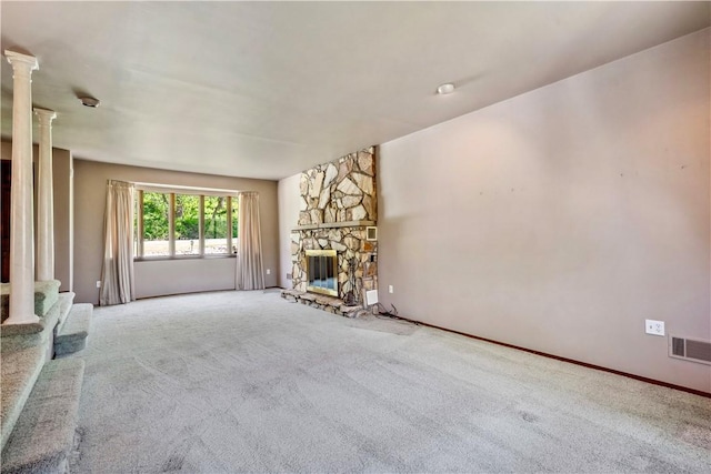 2408 Georgette St, Overbrook, PA 15234 - unfurnished living room featuring a fireplace, carpet flooring, ornate columns, and visible vents