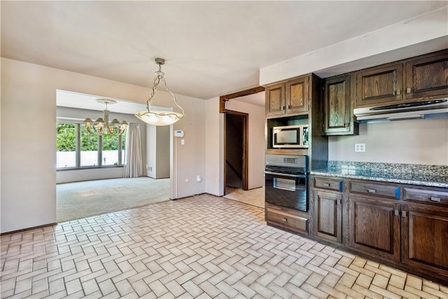 2408 Georgette St, Overbrook, PA 15234 - kitchen featuring brick patterned floor, oven, stainless steel microwave, under cabinet range hood, and a chandelier