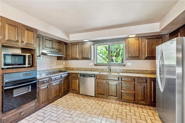 2408 Georgette St, Overbrook, PA 15234 - kitchen with a sink, brick floor, black appliances, and under cabinet range hood
