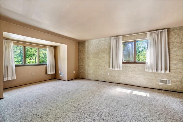 2408 Georgette St, Overbrook, PA 15234 - empty room featuring carpet floors, plenty of natural light, and visible vents