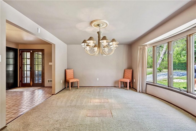 2408 Georgette St, Overbrook, PA 15234 - unfurnished room with baseboards, visible vents, carpet, and a notable chandelier
