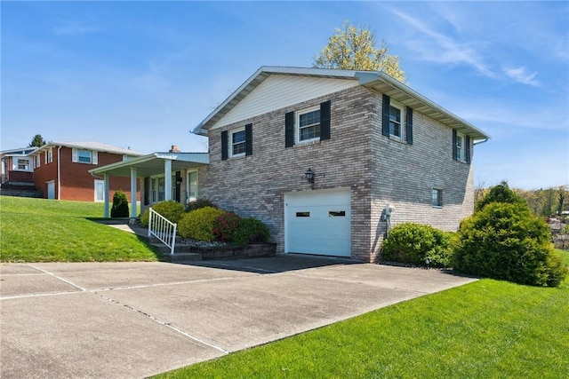 tri-level home featuring a front lawn, covered porch, brick siding, concrete driveway, and an attached garage