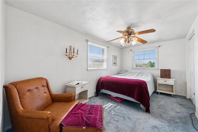 carpeted bedroom featuring a ceiling fan and a closet