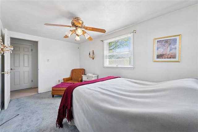 bedroom featuring ceiling fan and carpet