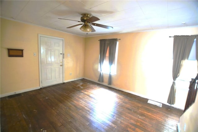 unfurnished room with ceiling fan, ornamental molding, hardwood / wood-style flooring, and visible vents