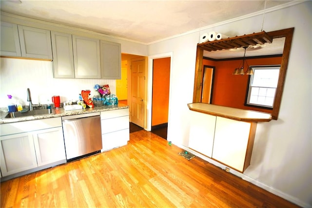 kitchen with stainless steel dishwasher, a sink, crown molding, and light wood-type flooring