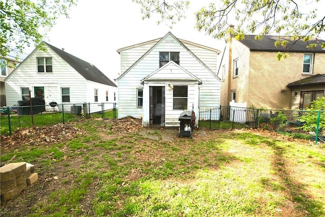 back of house with a fenced backyard