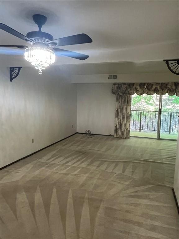 unfurnished room with baseboards, ceiling fan, visible vents, and light colored carpet