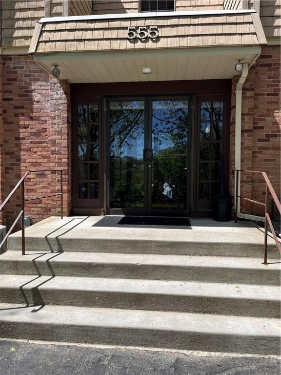 entrance to property with french doors and brick siding
