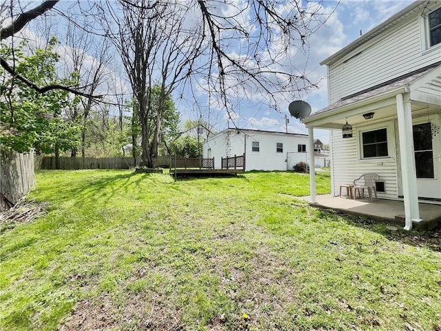 view of yard with fence and a patio