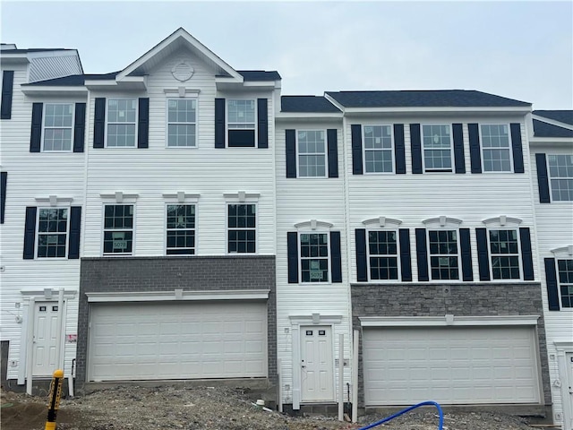 175 Lockheed Dr, Moon/Crescent Twp, PA 15108 - view of property featuring a garage, driveway, and stone siding