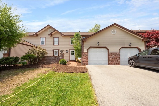 1470 Yorktown Dr, Cecil, PA 15055 - view of front of property featuring concrete driveway, brick siding, an attached garage, and a front lawn