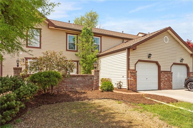 1470 Yorktown Dr, Cecil, PA 15055 - exterior space featuring brick siding, driveway, a shingled roof, and a garage
