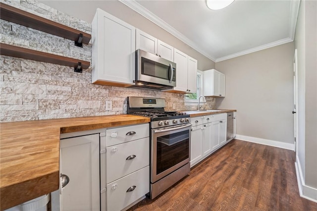 5672 6th St, Baldwin Boro, PA 15236 - kitchen with crown molding, appliances with stainless steel finishes, a sink, butcher block countertops, and baseboards