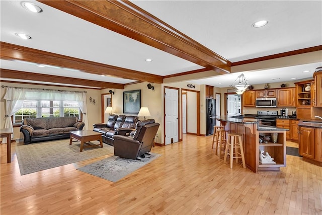 living room featuring light wood-style floors, recessed lighting, and beam ceiling