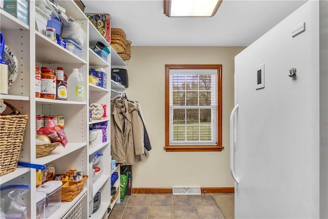 mudroom with baseboards and visible vents