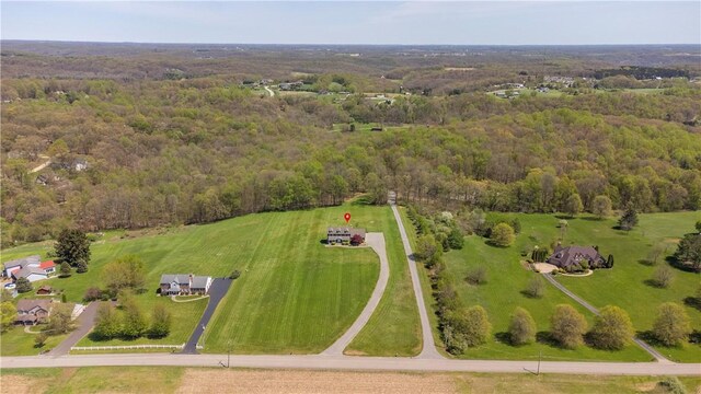 drone / aerial view with a view of trees