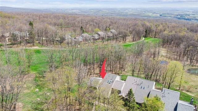 bird's eye view featuring a forest view