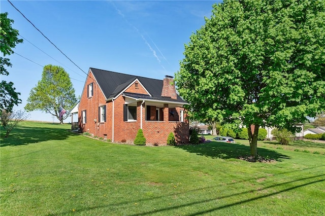 244 S Rebecca St, Saxonburg Boro, PA 16056 - view of home's exterior featuring brick siding, crawl space, a yard, and a chimney