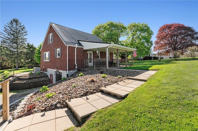 244 S Rebecca St, Saxonburg Boro, PA 16056 - view of side of home with a lawn, central AC, brick siding, metal roof, and a porch