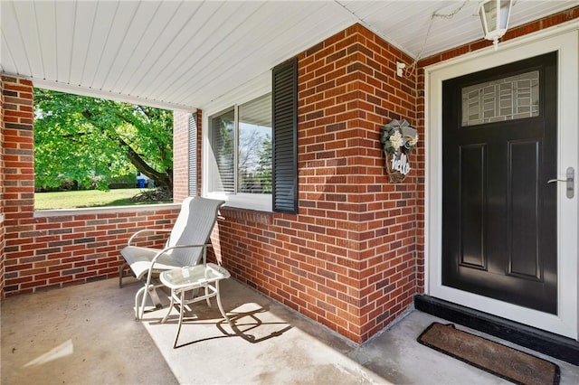 244 S Rebecca St, Saxonburg Boro, PA 16056 - doorway to property featuring a porch and brick siding