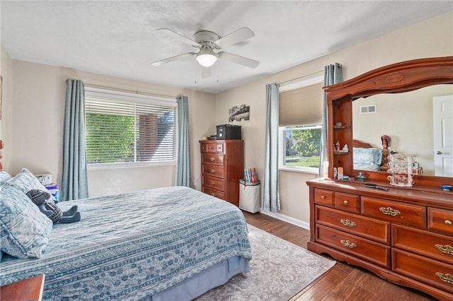 244 S Rebecca St, Saxonburg Boro, PA 16056 - bedroom with multiple windows, a ceiling fan, dark wood finished floors, and visible vents