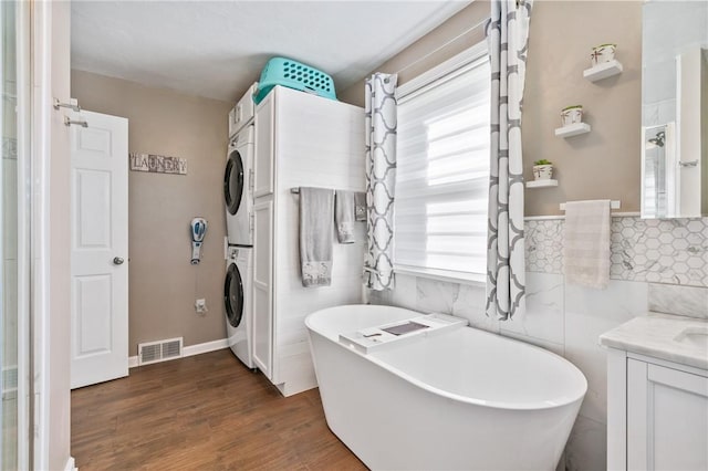 244 S Rebecca St, Saxonburg Boro, PA 16056 - full bath with vanity, a wealth of natural light, stacked washer and clothes dryer, and visible vents