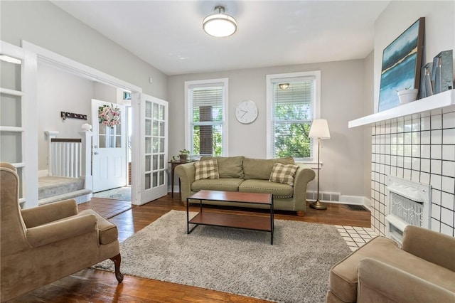 4004 Windsor St, Greenfield, PA 15217 - living area featuring visible vents, baseboards, wood finished floors, and a tiled fireplace