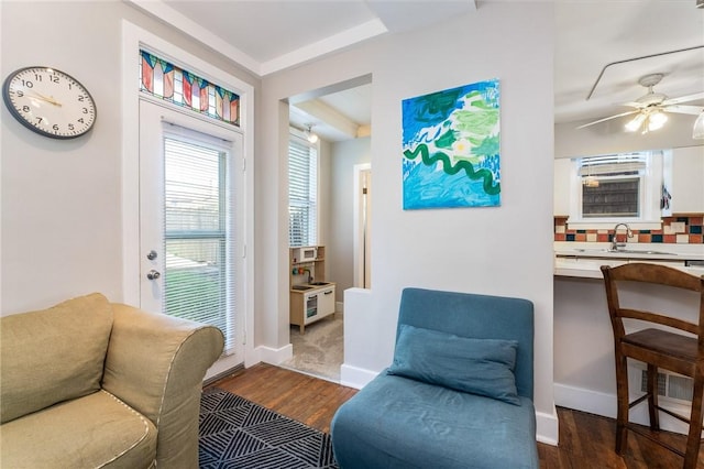 4004 Windsor St, Greenfield, PA 15217 - living area with dark wood-style flooring, a ceiling fan, and baseboards