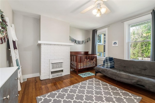 4004 Windsor St, Greenfield, PA 15217 - bedroom with baseboards, ceiling fan, a fireplace, and hardwood / wood-style flooring