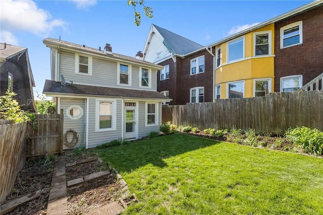4004 Windsor St, Greenfield, PA 15217 - back of house featuring a fenced backyard, a chimney, and a lawn