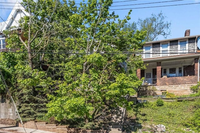 4004 Windsor St, Greenfield, PA 15217 - view of front of house with covered porch, a chimney, and brick siding