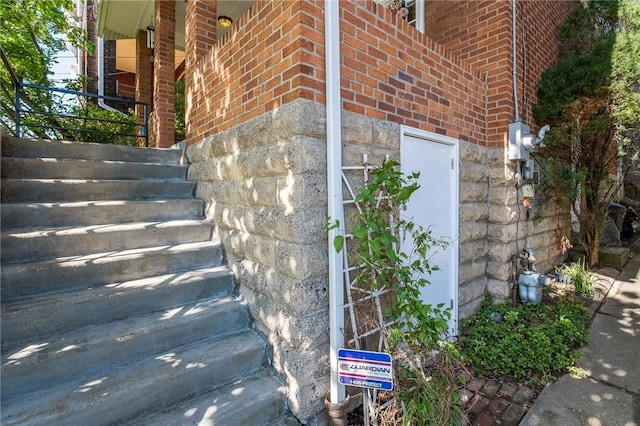 4004 Windsor St, Greenfield, PA 15217 - exterior details with brick siding, stairway, and gas meter