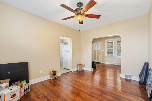 4128 Winterburn, Greenfield, PA 15207 - unfurnished living room featuring arched walkways, a ceiling fan, wood finished floors, and visible vents