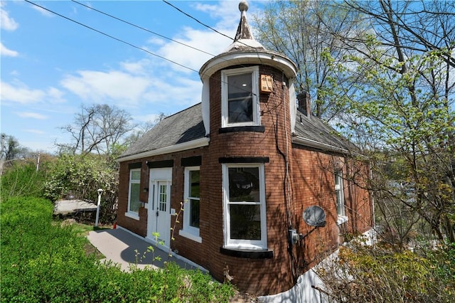 205 Berkley Ave, Forest Hills Boro, PA 15221 - rear view of property with brick siding and a shingled roof
