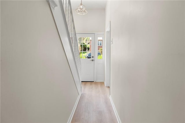 205 Berkley Ave, Forest Hills Boro, PA 15221 - hallway with light wood-style floors, baseboards, and a notable chandelier