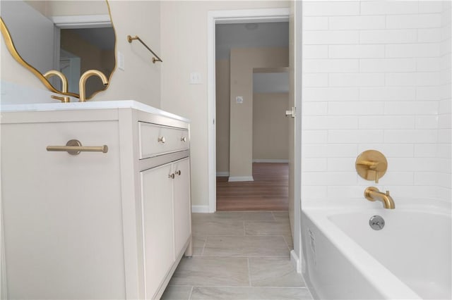 205 Berkley Ave, Forest Hills Boro, PA 15221 - full bathroom featuring vanity, baseboards, and washtub / shower combination
