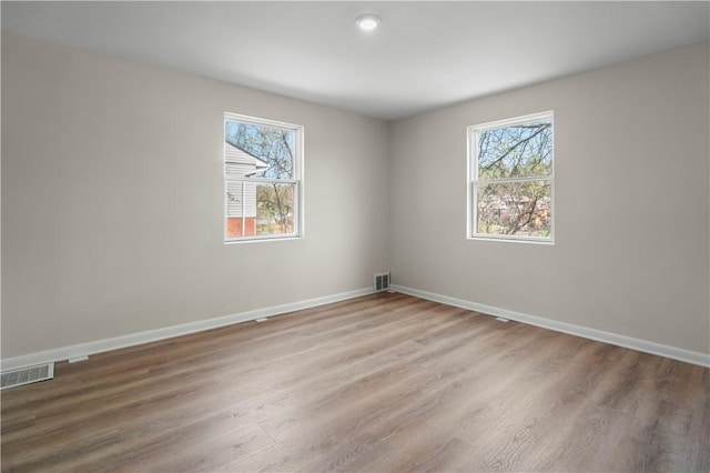 205 Berkley Ave, Forest Hills Boro, PA 15221 - unfurnished room featuring a healthy amount of sunlight, wood finished floors, and visible vents