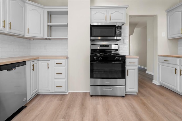 205 Berkley Ave, Forest Hills Boro, PA 15221 - kitchen with stainless steel appliances, wood counters, decorative backsplash, and light wood finished floors