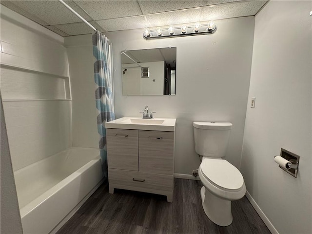 bathroom featuring baseboards, vanity, toilet, and wood finished floors
