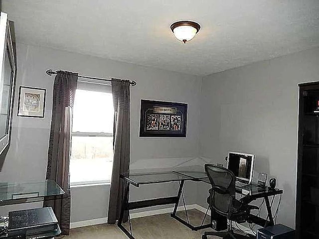 home office featuring baseboards and plenty of natural light