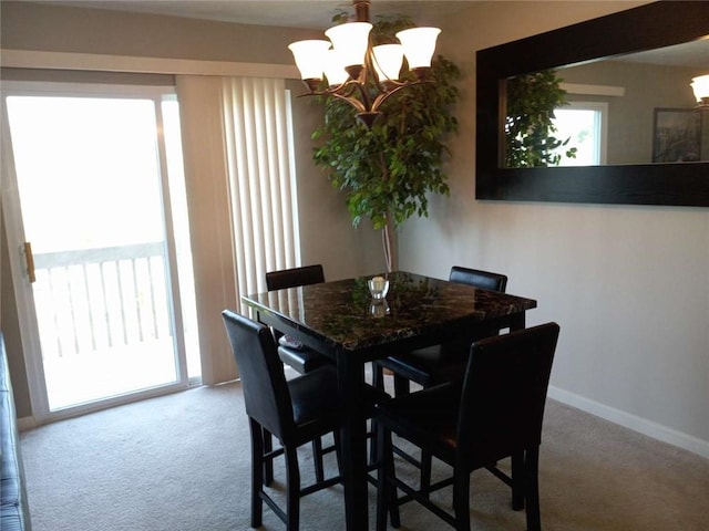 116 Antlerhollow Ct, Cranberry Twp, PA 16066 - dining room featuring a chandelier, carpet, and baseboards