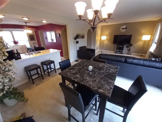 116 Antler Hollow Ct, Cranberry Twp, PA 16066 - dining space with arched walkways, a chandelier, ceiling fan, and light colored carpet