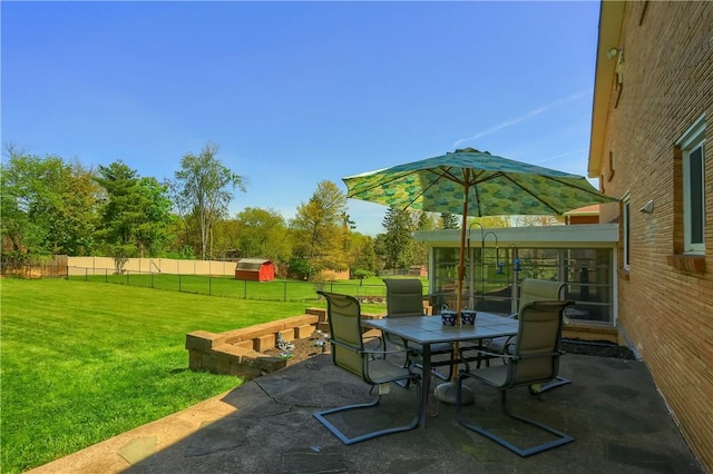 view of patio with outdoor dining area and a fenced backyard